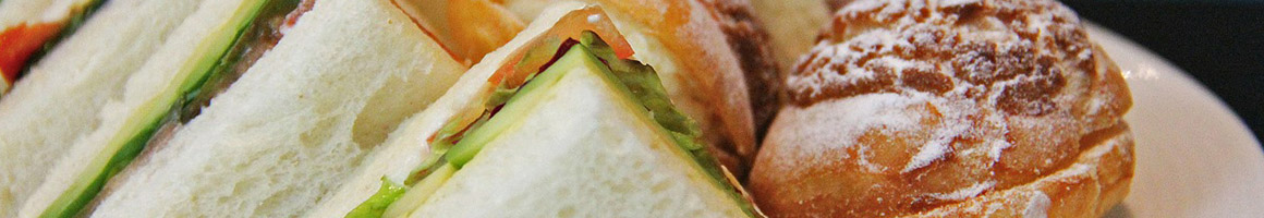 Eating Burger Deli Sandwich at Redwood Deli restaurant in Forest Hills, NY.